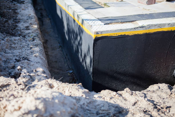 Professional Waterproofing technician working in McComb, OH